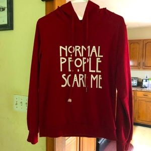 Red hooded sweatshirt “normal people scare me”